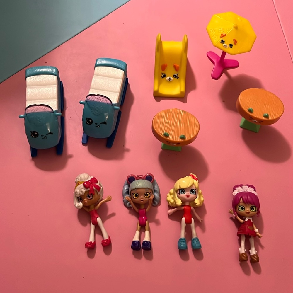 Lot of Shopkins dolls, 2x sleds, 2x tables, slide and umbrella